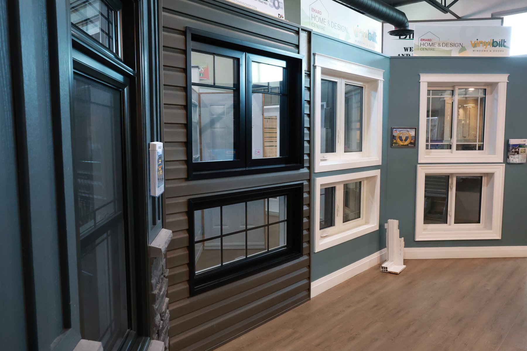 Windows on display against siding and stone in the Emard Home & Design Centre showroom in Cornwall